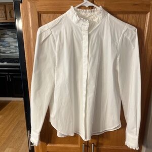 White blouse with ruffle trim